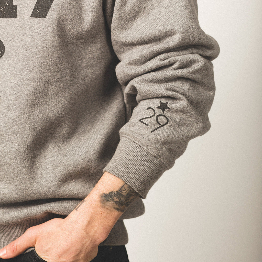 vintage heather grey sweatshirt with 29th State Apparel logo on left sleeve right above the wrist cuff