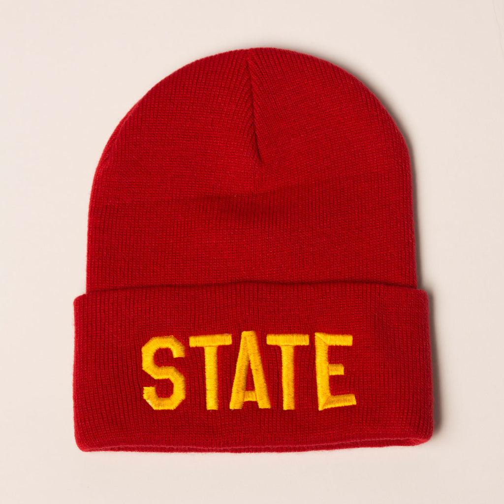 red beanie with folding cuff state in gold on front center