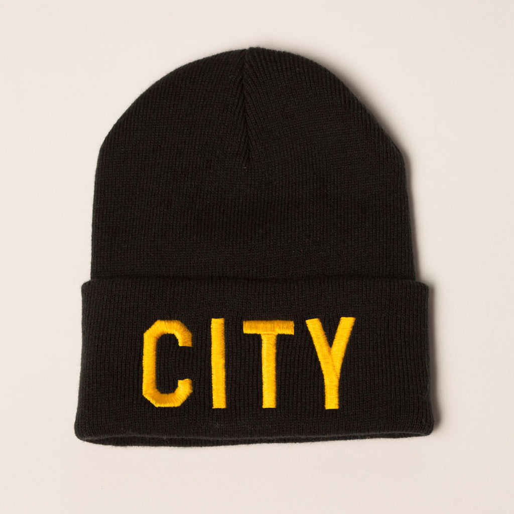 black beanie folding cuff city on front in gold bold lettering