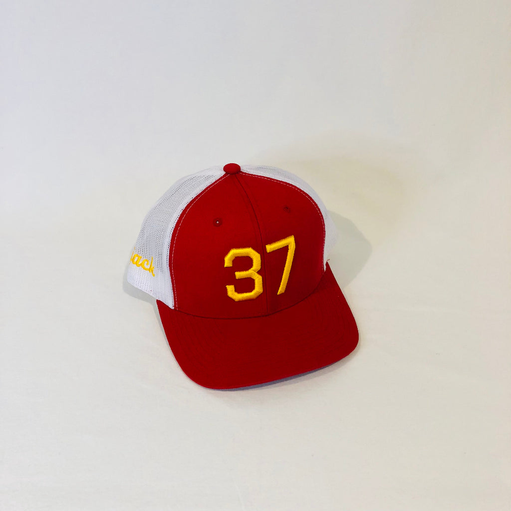 red and white trucker hat with 37 in gold puff embroidery on the front