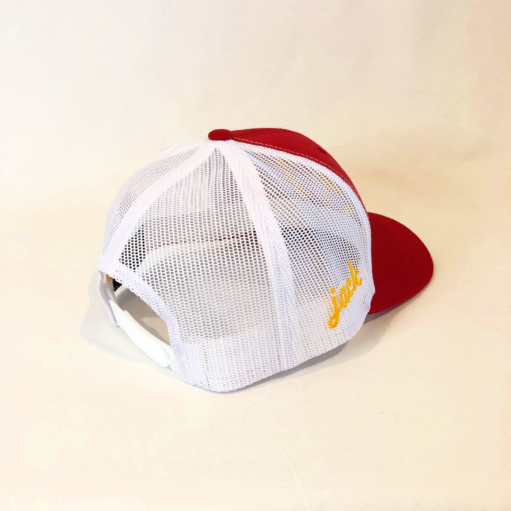 red and white trucker hat with jack in gold on the right side 
