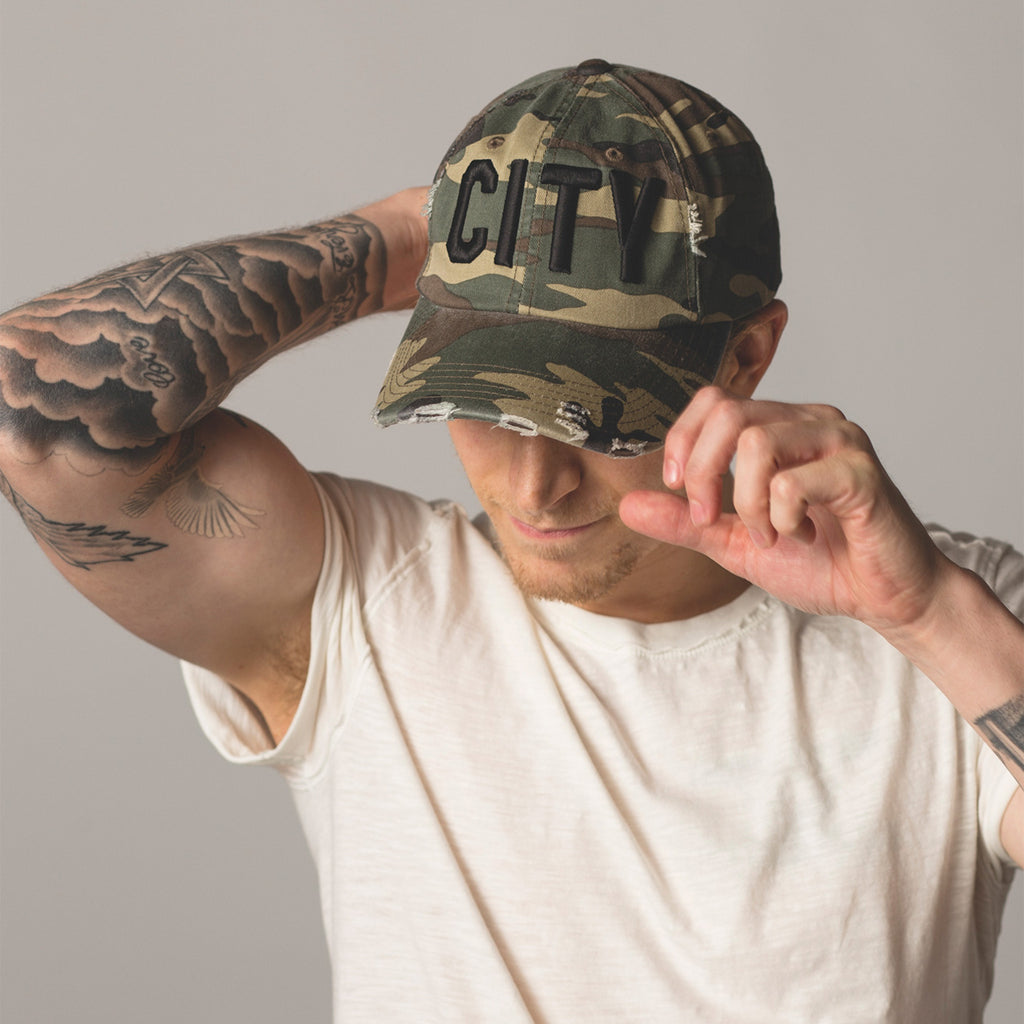 front view on model CITY Distressed Baseball Hat camo