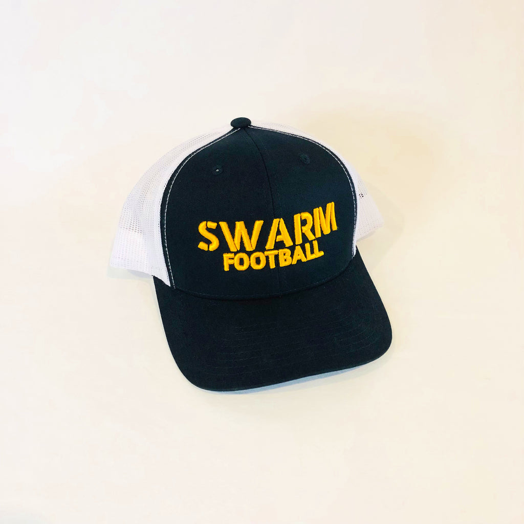 black and white meshback trucker hat swarm football embroidered in bold gold lettering on the front