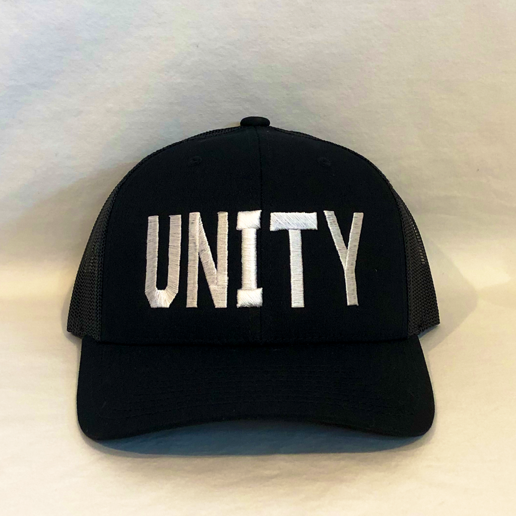 all black trucker hat meshback with unity in all caps embroidered on front