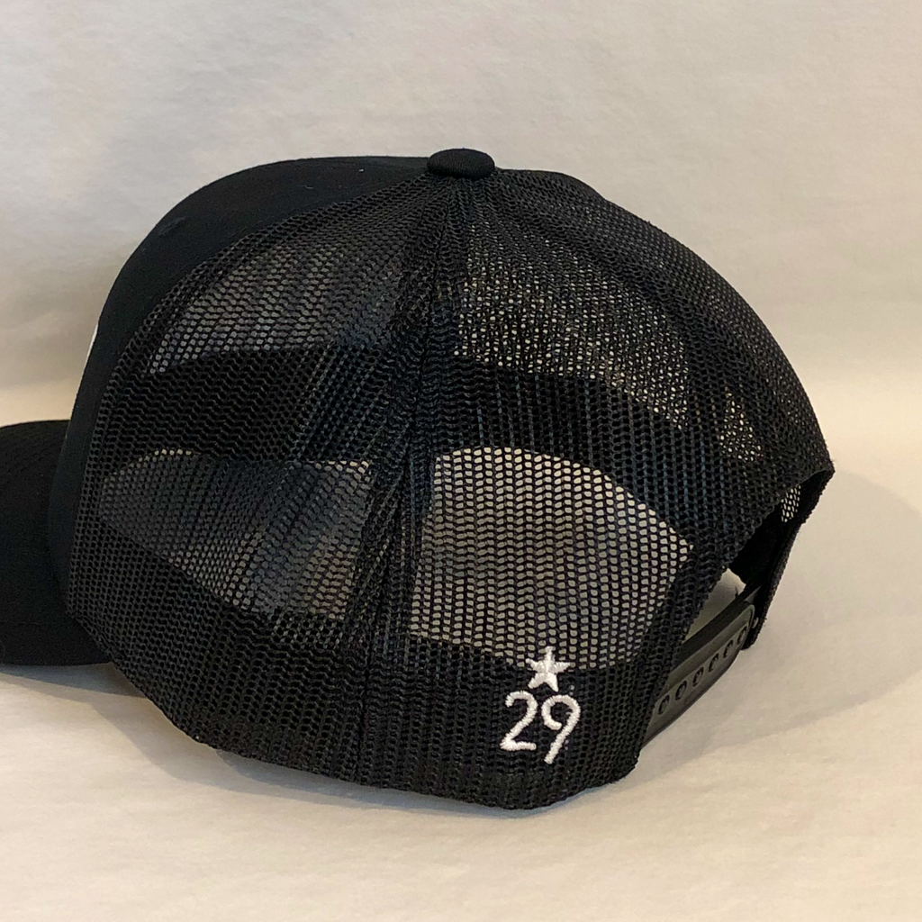 all black trucker hat meshback showcasing the 29th State Apparel logo on back left panel next to plastic adjustment closure
