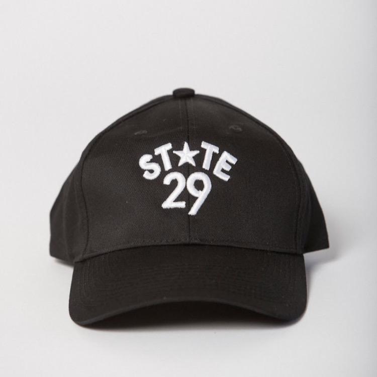 front view of black baseball hat with 29th state apparel logo embroidered on the front center in white